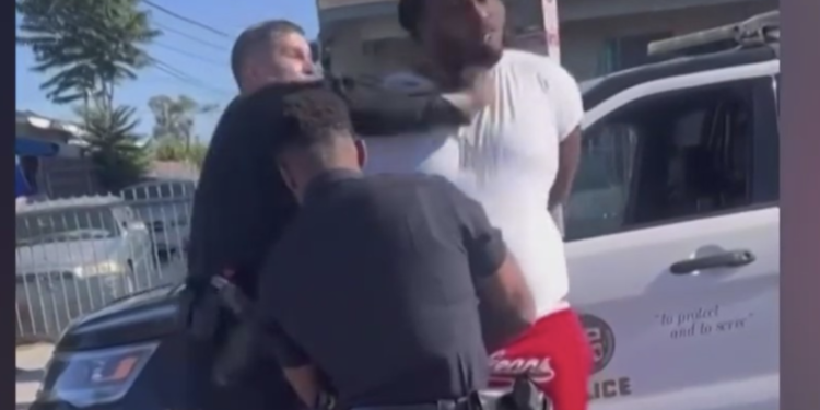 Police Punching Handcuffed Man During Arrest - Baller Alert LAPD Officer Temporarily Relieved of Duties After Video Shows Him Punching Handcuffed Man During Arrest